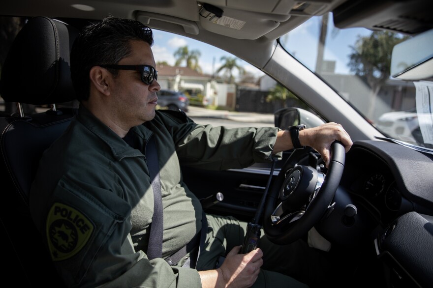 Wilson Linares, commander of the L.A. County law enforcement division of the California Department of Cannabis Control, heads to the location to serve a search warrant on an unlicensed cannabis store in Long Beach, Calif., on March 5, 2024.